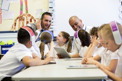 Music teacher engaging students through music education tools and technology