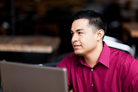 adult online learner with a laptop computer