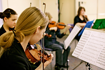 Young music student plays the violin