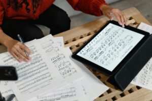 Person at a table researching music